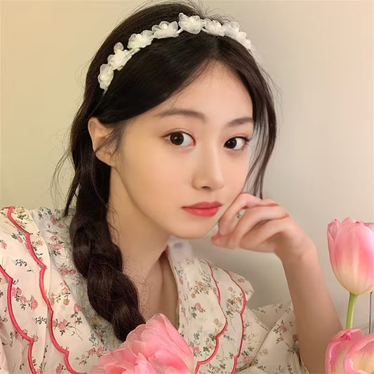 A White Pearl Flower Bridal Headband.