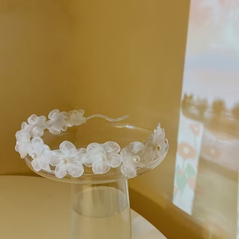 A White Pearl Flower Bridal Headband.