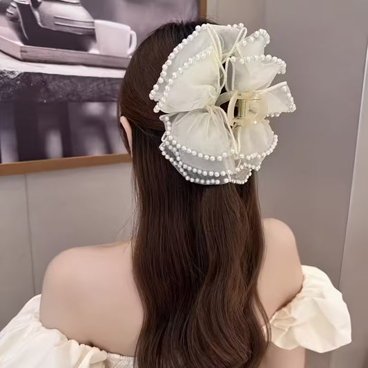 A Large Bubble Grab Clip Adorned with Faux Pearl Clouds, Perfect for Adding Volume to Your Hair.