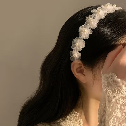 A White Pearl Flower Bridal Headband.