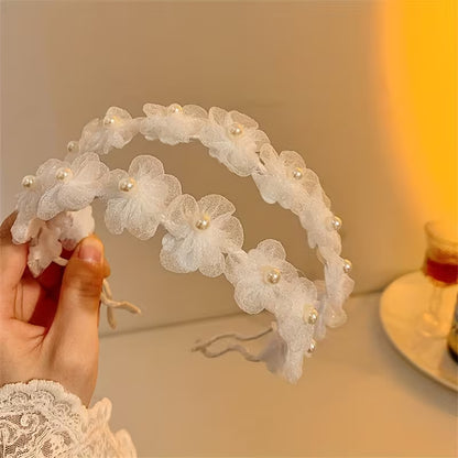 A White Pearl Flower Bridal Headband.