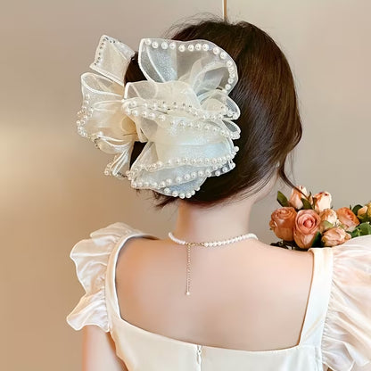 A Large Bubble Grab Clip Adorned with Faux Pearl Clouds, Perfect for Adding Volume to Your Hair.